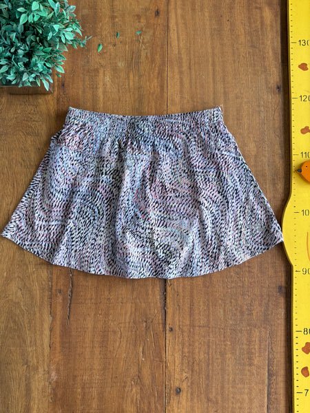Short Saia Track Field Estampa Lilas TAM 12 Anos